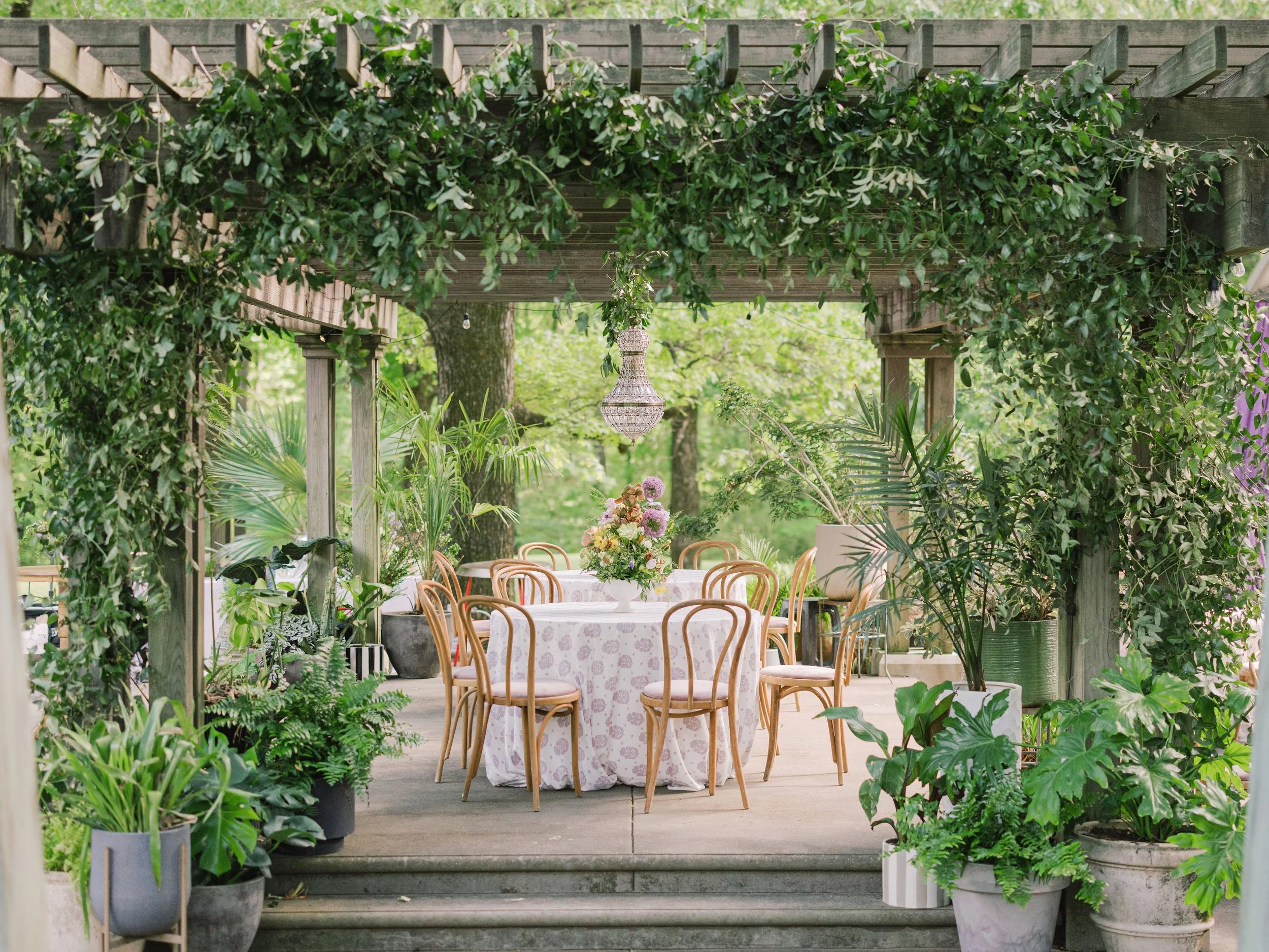 Luxury wedding reception design with natural wood dining chairs at Field and Forest in Mississippi. 