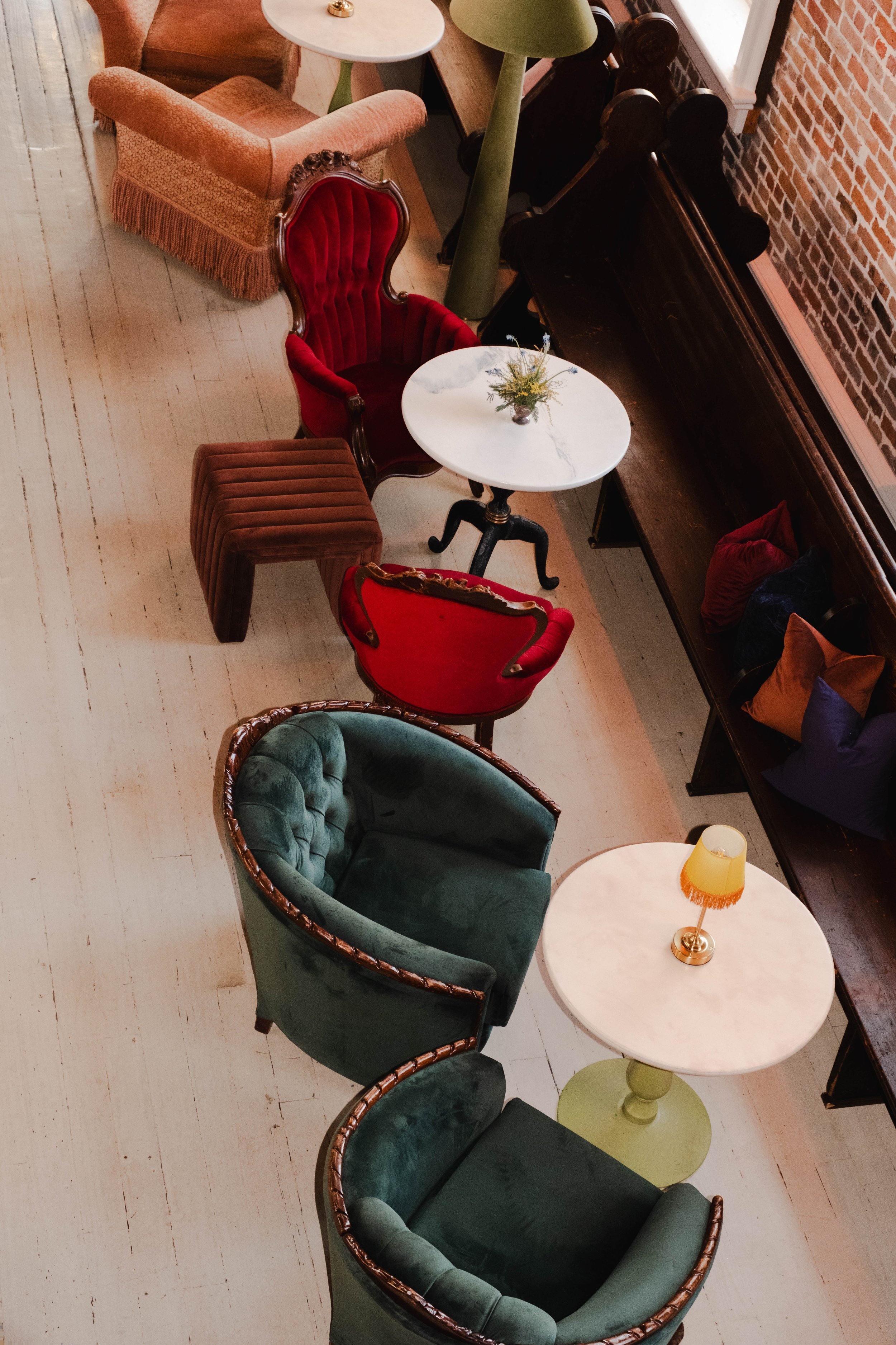 A wedding reception design with mixed lounge seating with cabaret tables, and floor lamps at Felicity Church in New Orleans.
