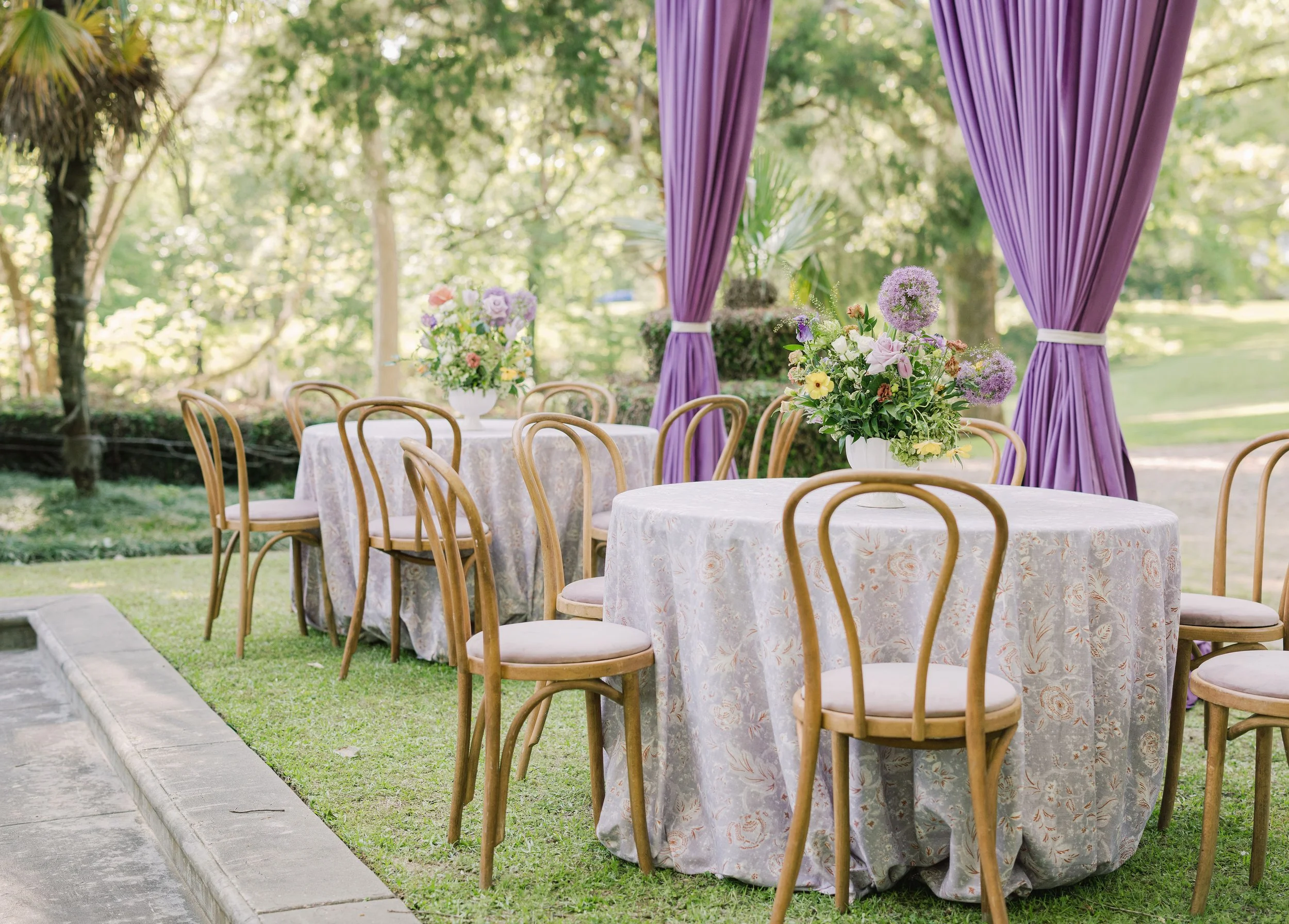 Luxury wedding reception design with natural wood dining chairs at Field and Forest in Mississippi. 