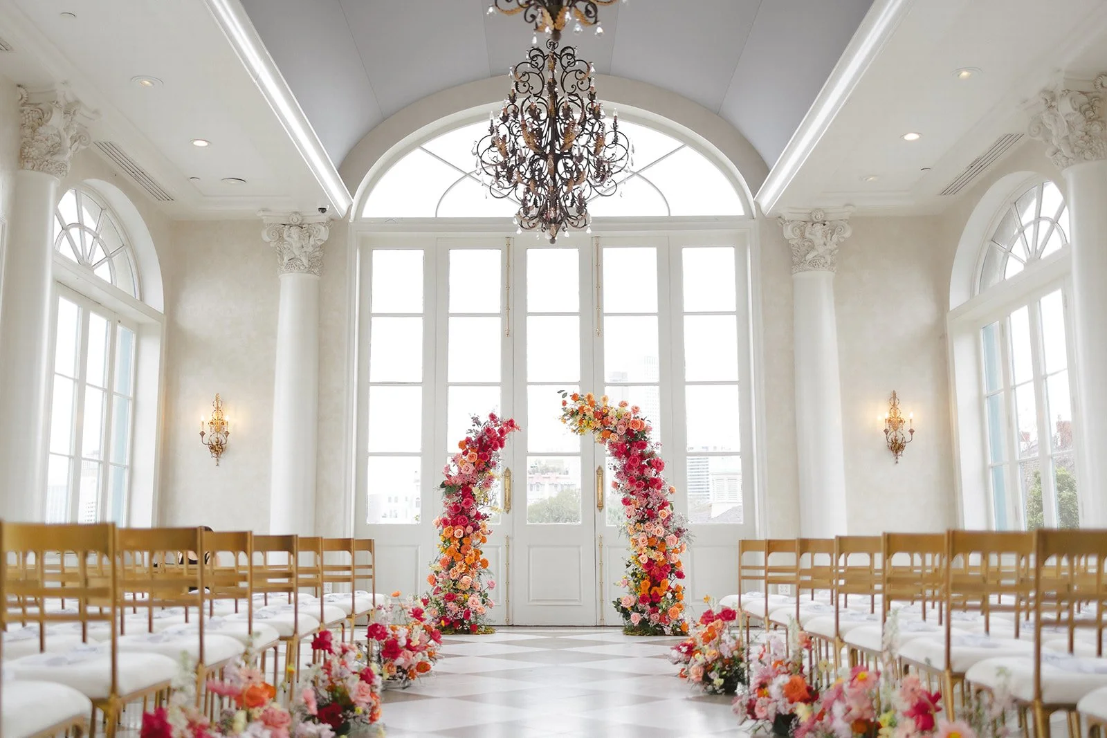 Wedding ceremony design with gold chairs at Marche in New Orleans.