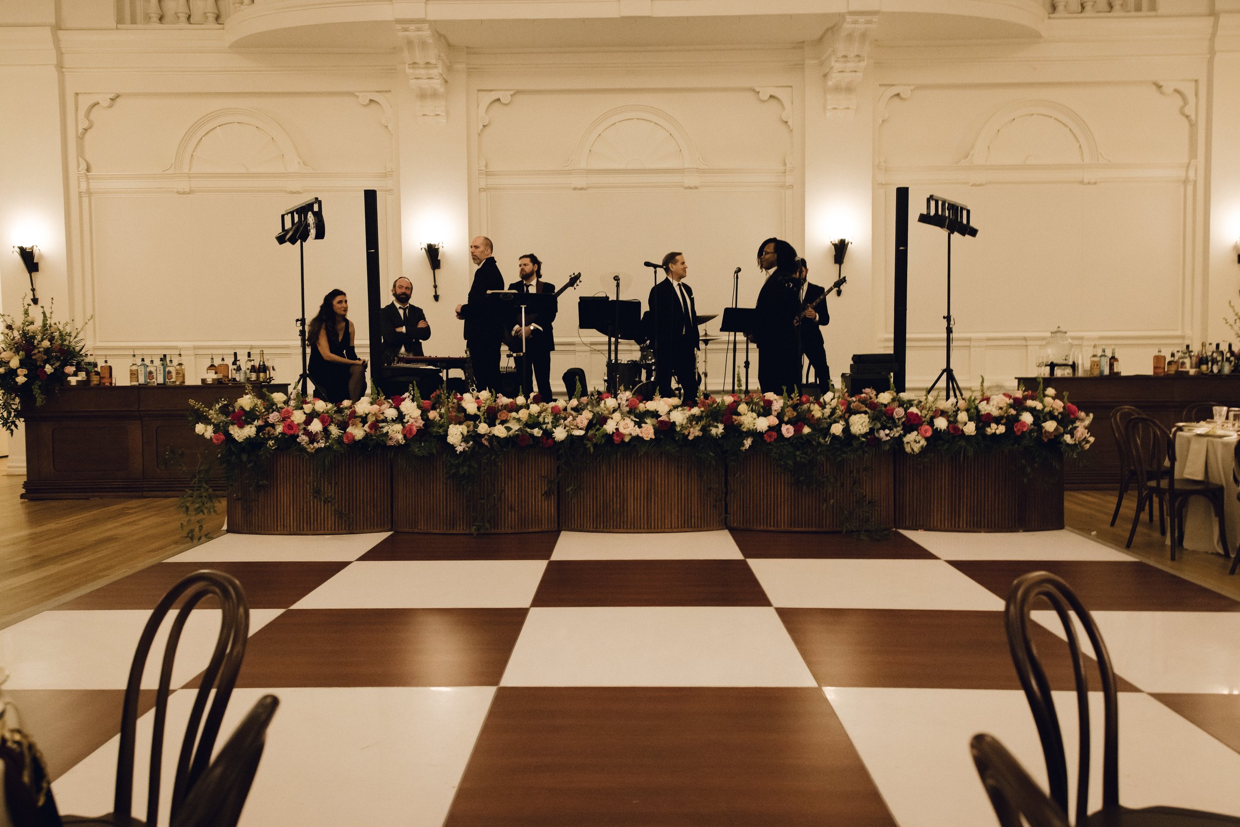 A wedding reception design with walnut stage fronts, and walnut bars at the New Orleans Board of Trade. 