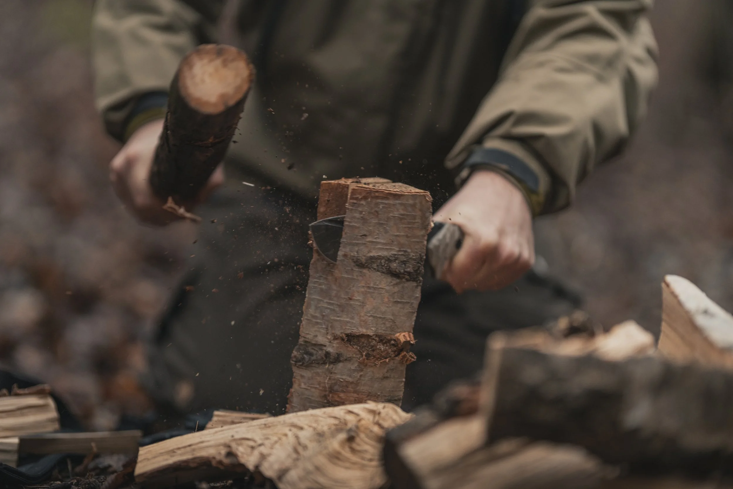 Batonig the wood while prepping the fire