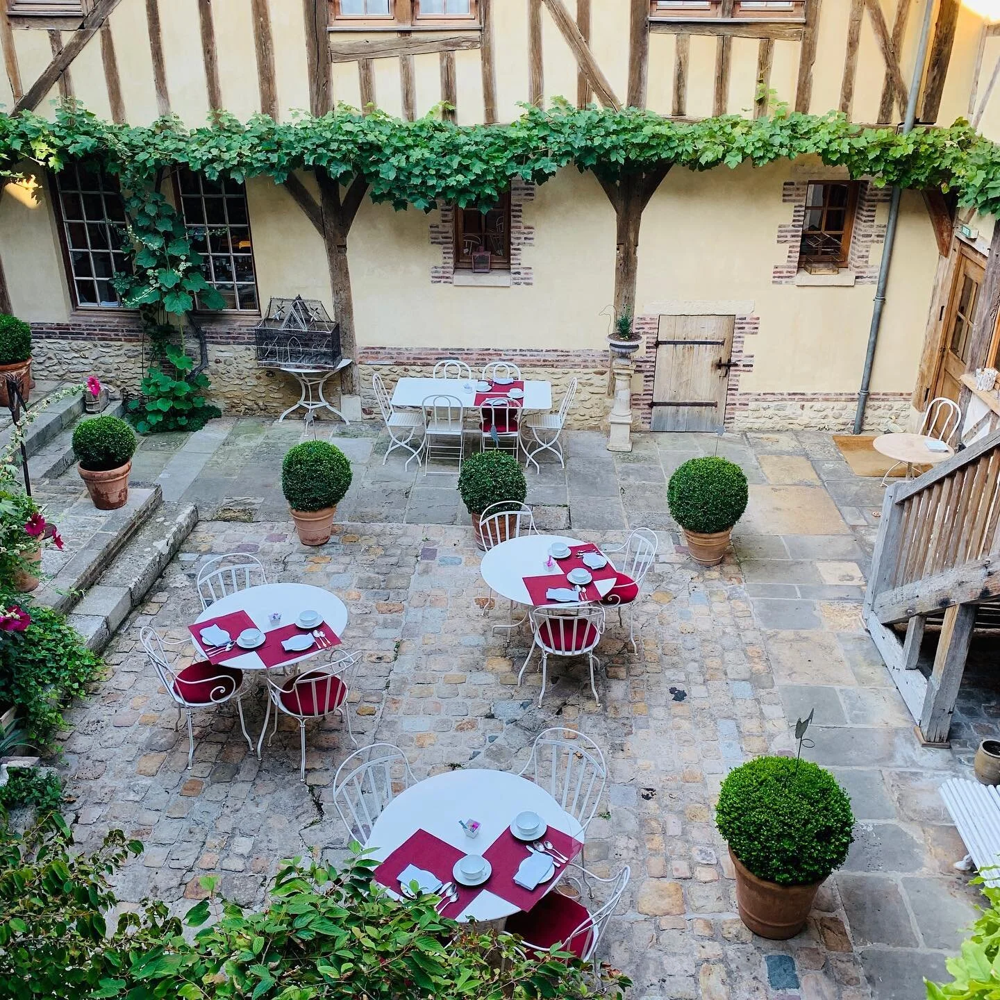 Throwback to a year ago in Troyes France.  Socially distanced tables at Le Champ des Oiseaux &amp; Spa before it was even a thing. Troyes is such a beautiful city and this hotel is a fine example of a restoration project that shows respect and sympat