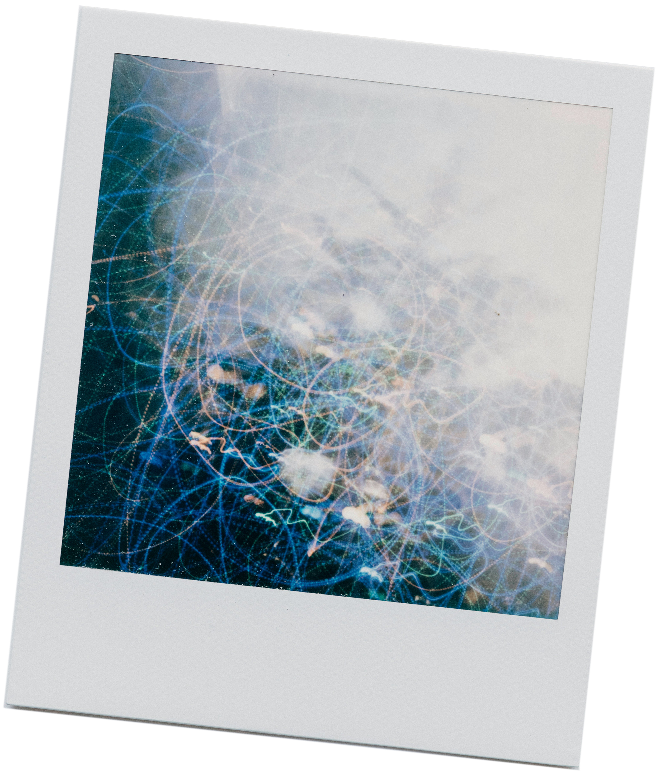 Abstract image with swirling blue and white light patterns resembling sparkles or energy waves, creating a dreamy, ethereal effect.