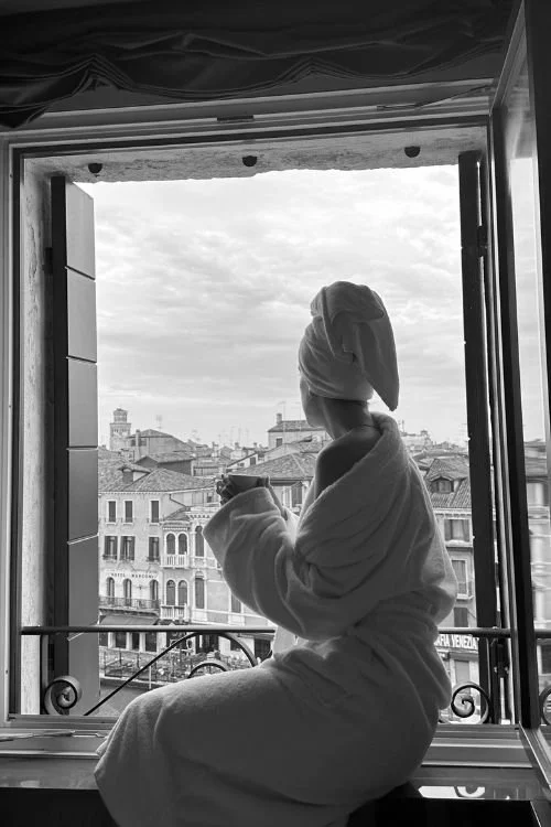 woman sitting in window