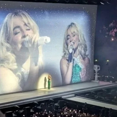 Sabrina Carpenter Blonde Blue Outfit Singing on Stage Spotlight