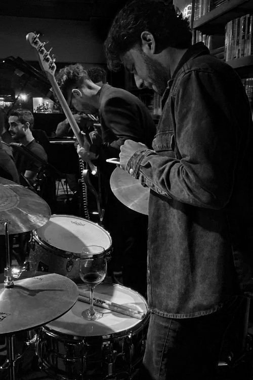 artist checking phone after gig