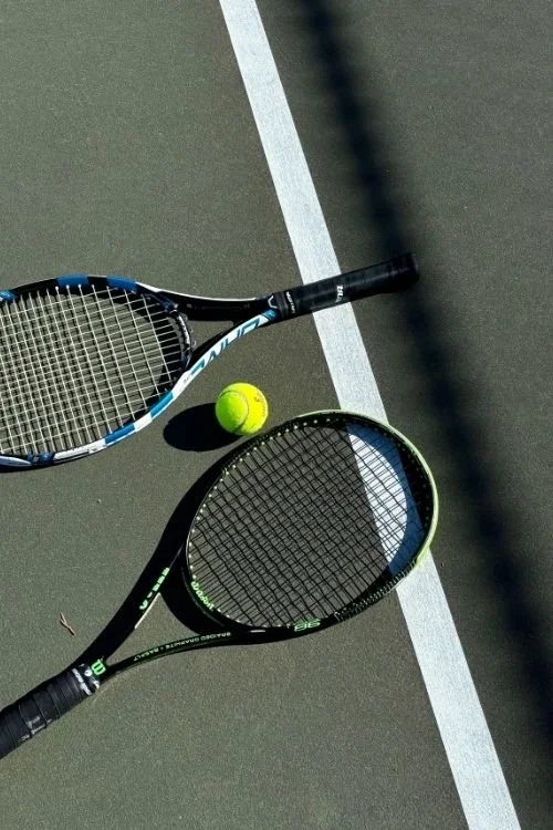 tennis rackets on court