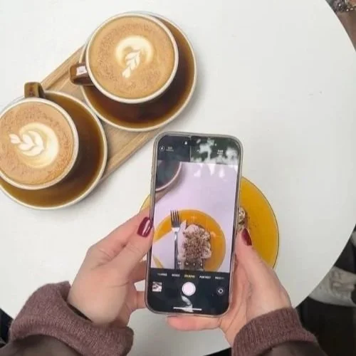 Coffee phone taking photo