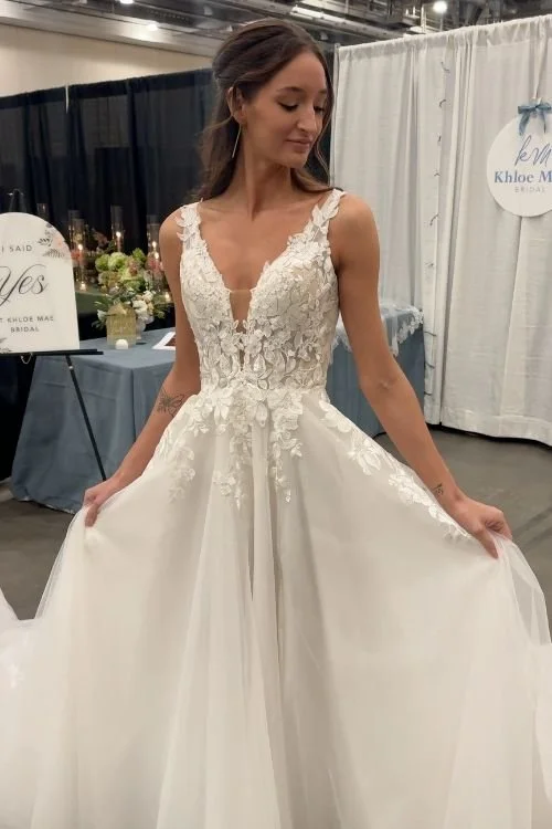 Model brunette woman wearing white lace boho ballroom wedding dress