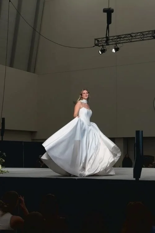 white wedding dress on model runway show