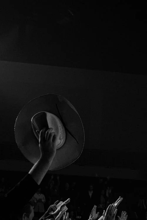 cowboy hat in air country music concert