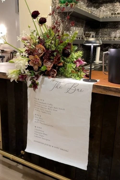 Bar sign floral arrangement