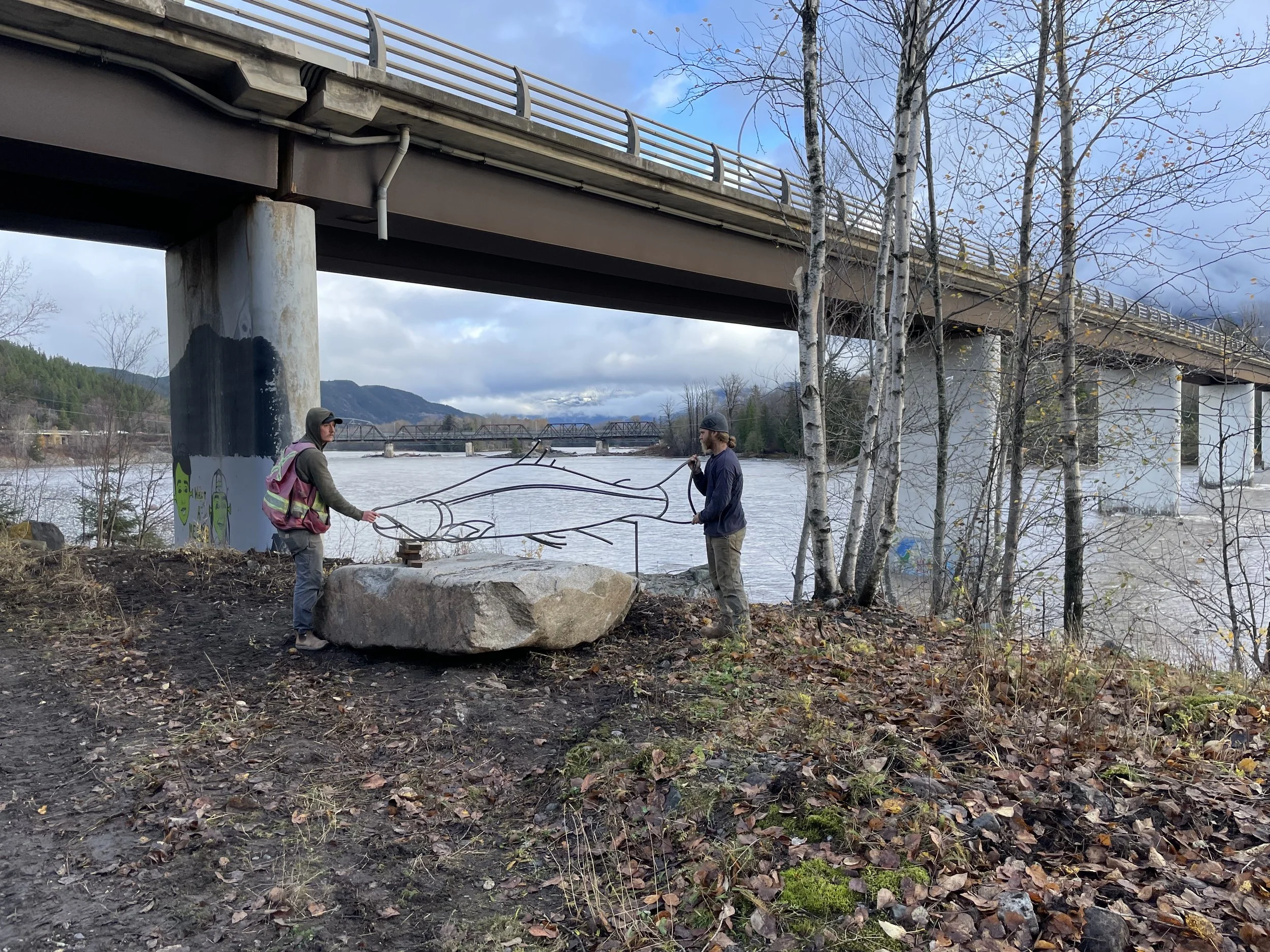 placing salmon sculpture