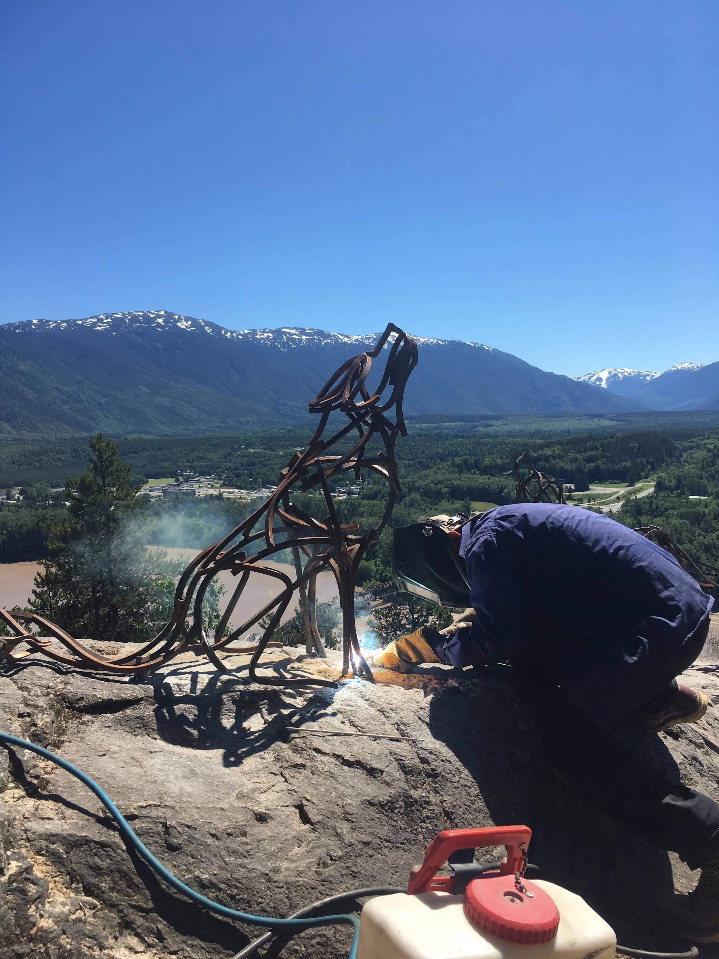 welding steel sculptures in place 
