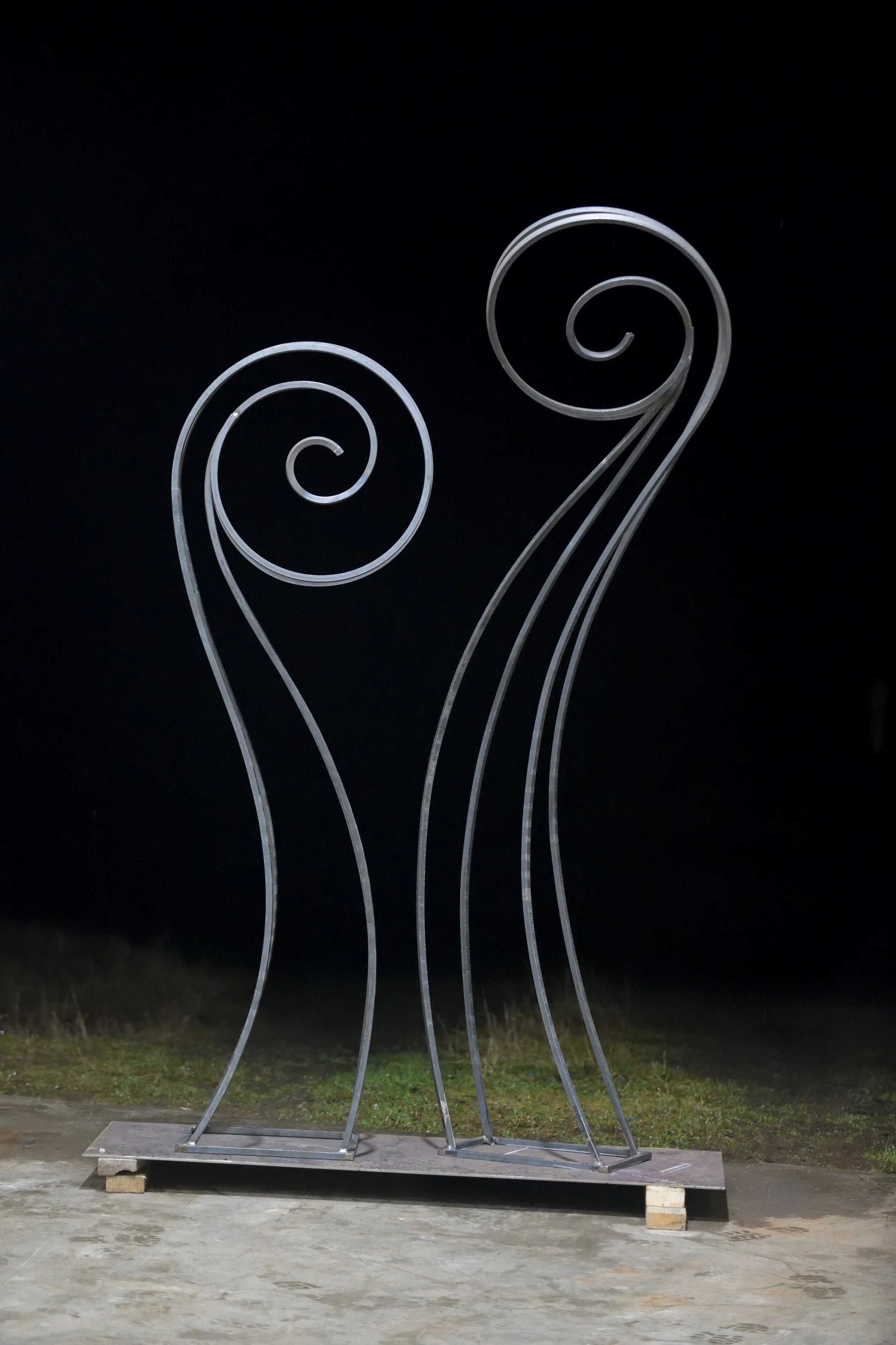 Steel sculpture of a pair of fiddleheads