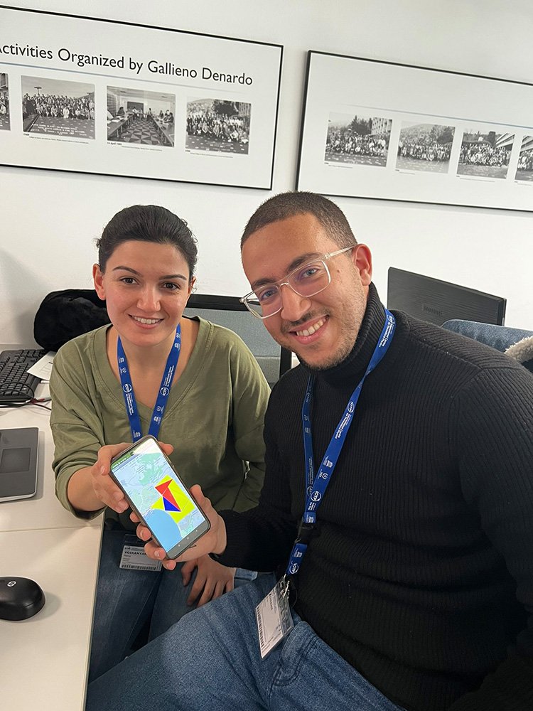  Marine Voskanyan (left) and her lab partner show off their app that sends pollution sensor readings to the cloud, then creates a heat map that is updated across all apps. 