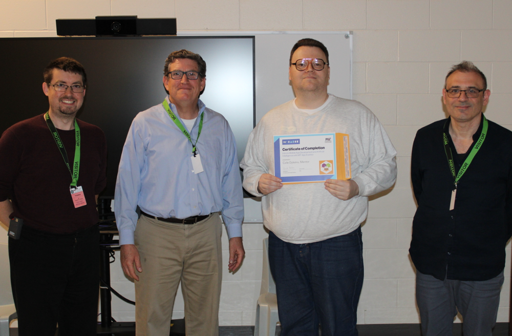  Mentor Cole Dykstra receives his certificate 