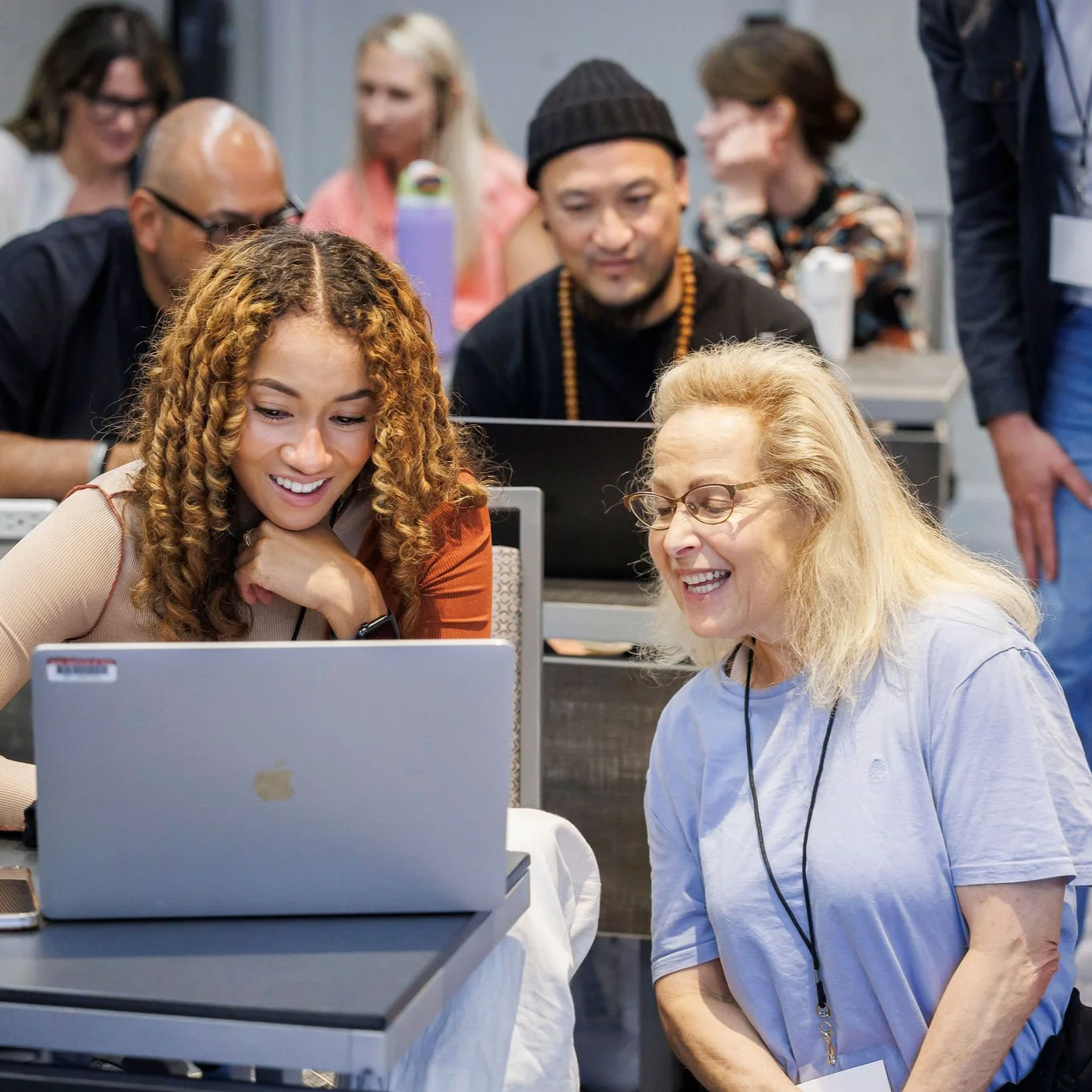 Two female teachers working together on a laptop