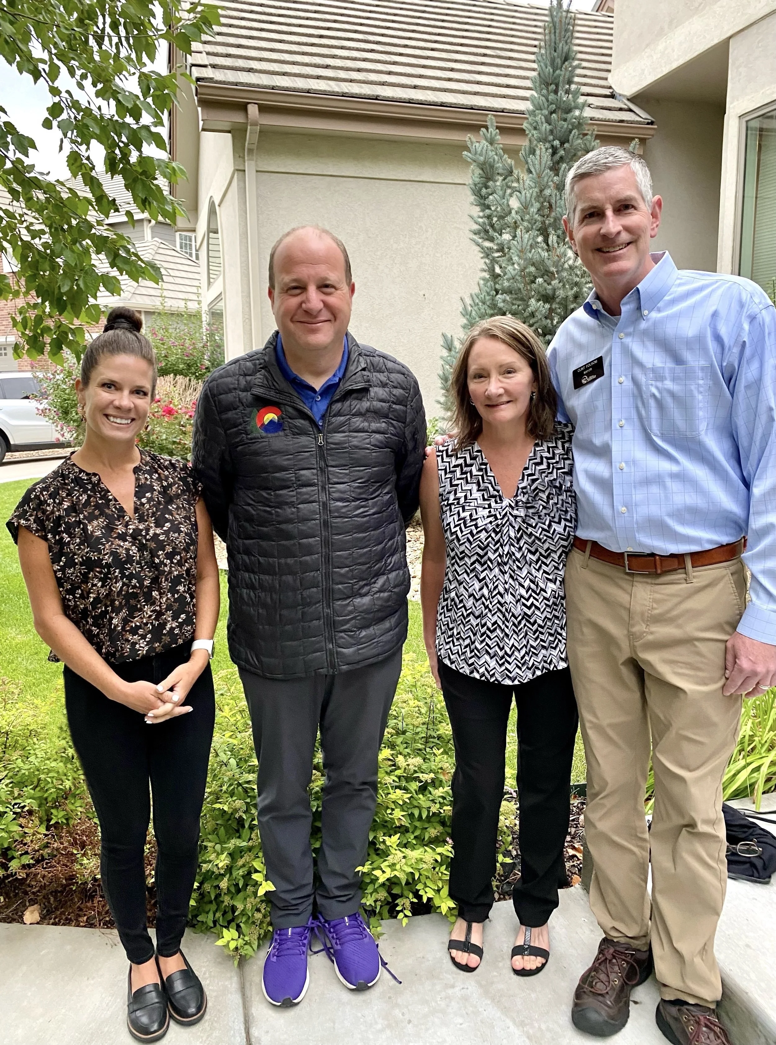 Chatting with Governor Polis, Mayor Clint Folsom, and the lovely Leslie Folsom at a fundraising event.