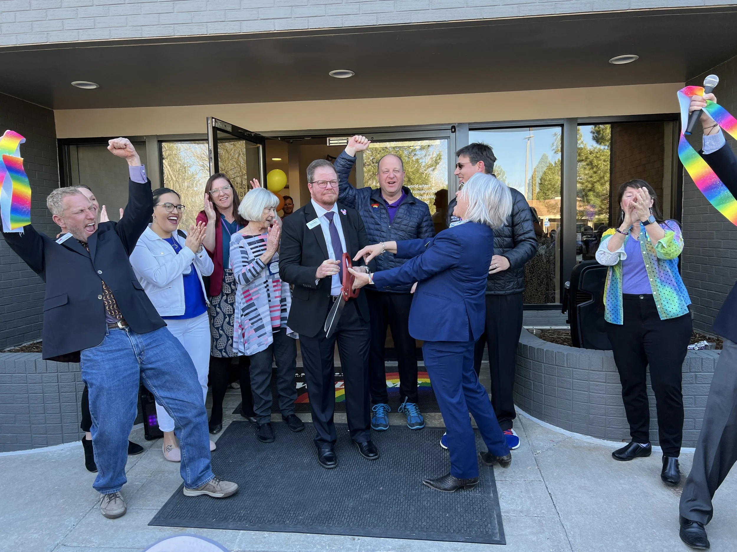 Celebrating the opening of Out Boulder County with Governor Polis and other community and chamber leaders.