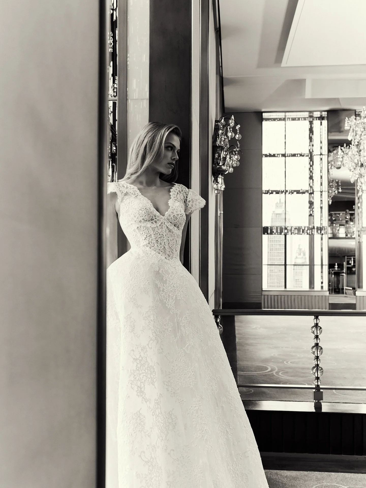 The new talk of the town ✨ introducing a closer look at &lsquo;Merion&rsquo; our v-neck, cap sleeve all lace gown with scalloped lace hemline and matching veil&mdash; she is quickly becoming Ms. Popular - discover why by visiting us online at marking