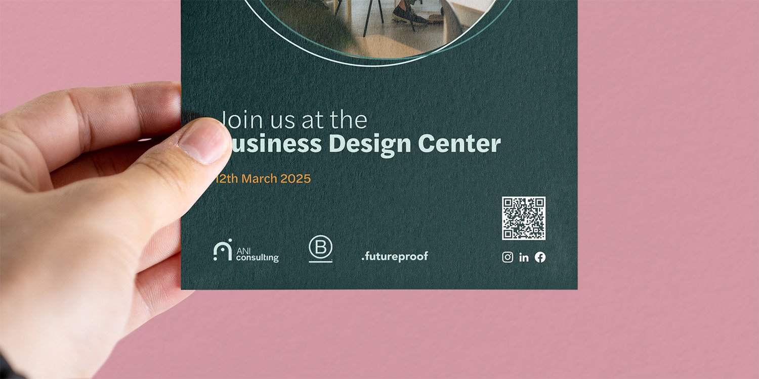 A person holding a green flyer with white and orange text promoting an event at the Business Design Center on March 12, 2025. The flyer includes a QR code, social media icons, and logos for ANI Consulting, a B symbol, and Futureproof.