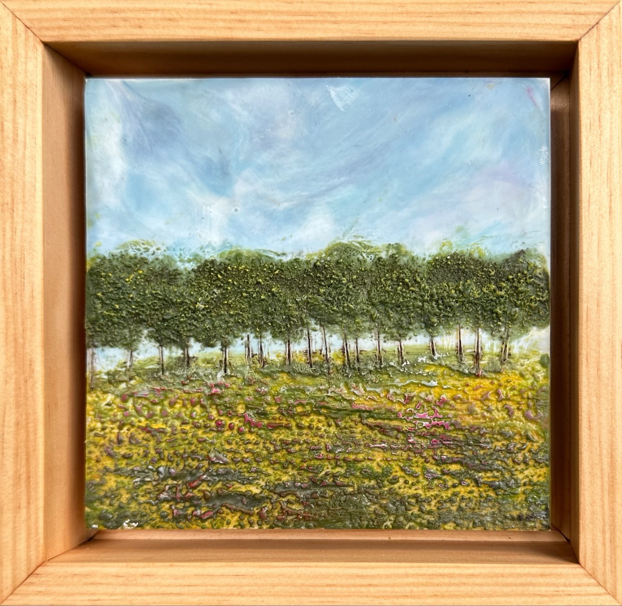 Tree-line-blue-sky-green-field-floral-encaustic-painting