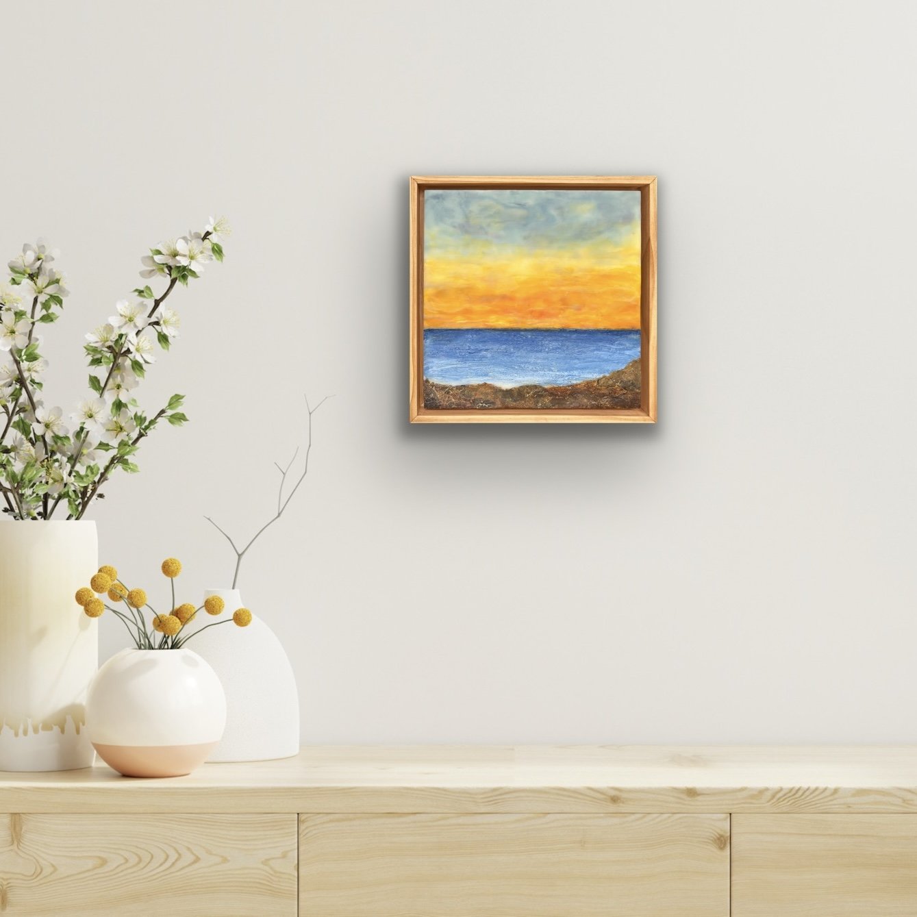 grey-and-orange-sky-blue-water-brown-rocks-landscape-encaustic-painting-with-collage-in-situ