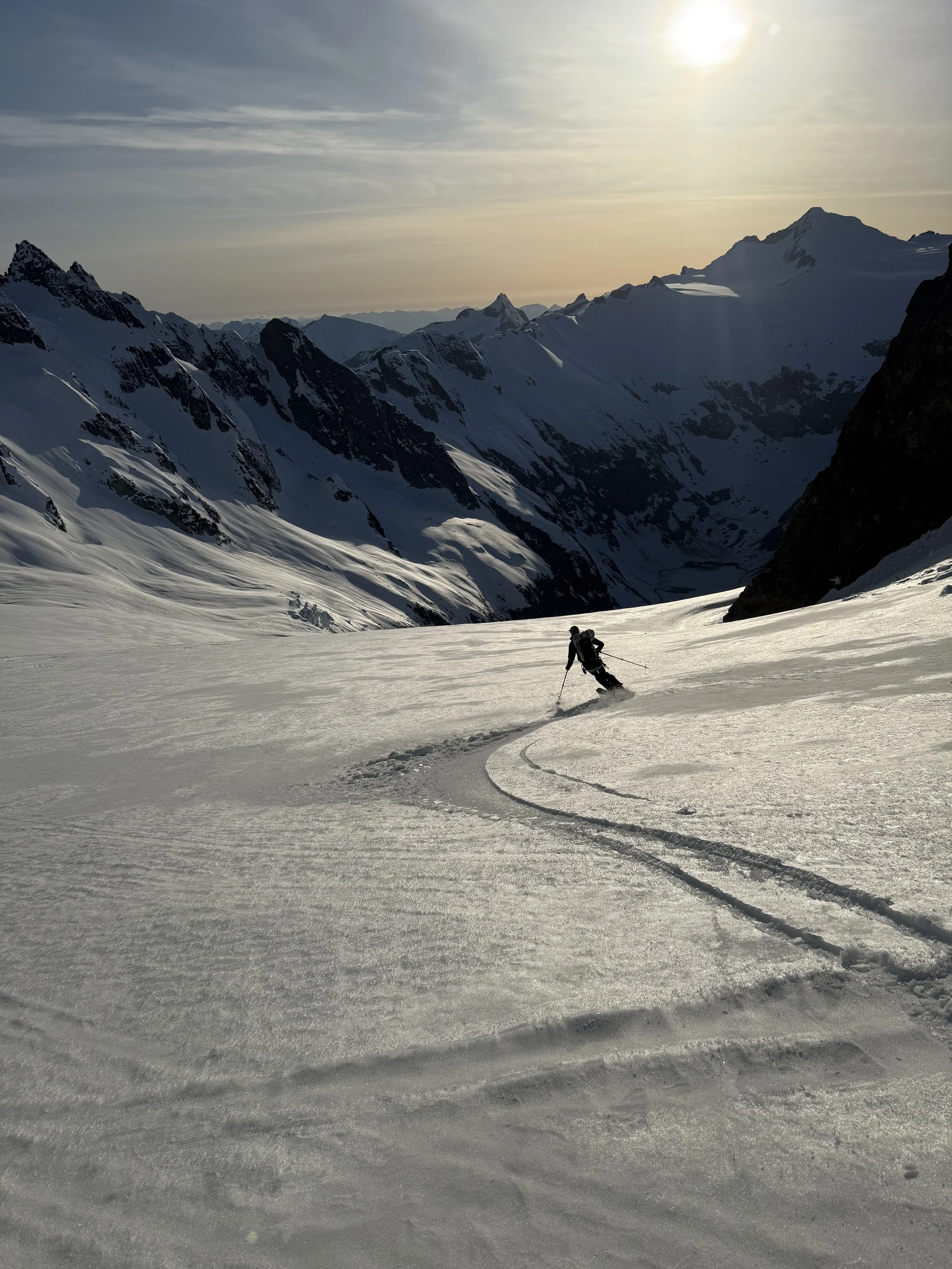 Skiing down the Forbidden Glacier down towards Moraine Lake with Eldorado peak loooming above while skiing the Forbidden Tour, North Cascades WA, Photo by Ian Nicholson