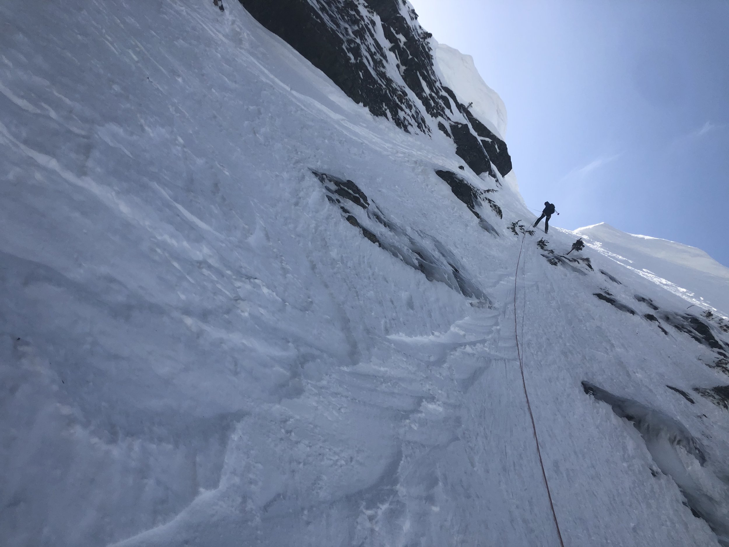 Looking up at the rap while Rappelling into the Snot Couloir on Mt. Snoqualmie, in the Snoqualmie Pass Backcountry. This Tour requires a 50+ meter rappel.
