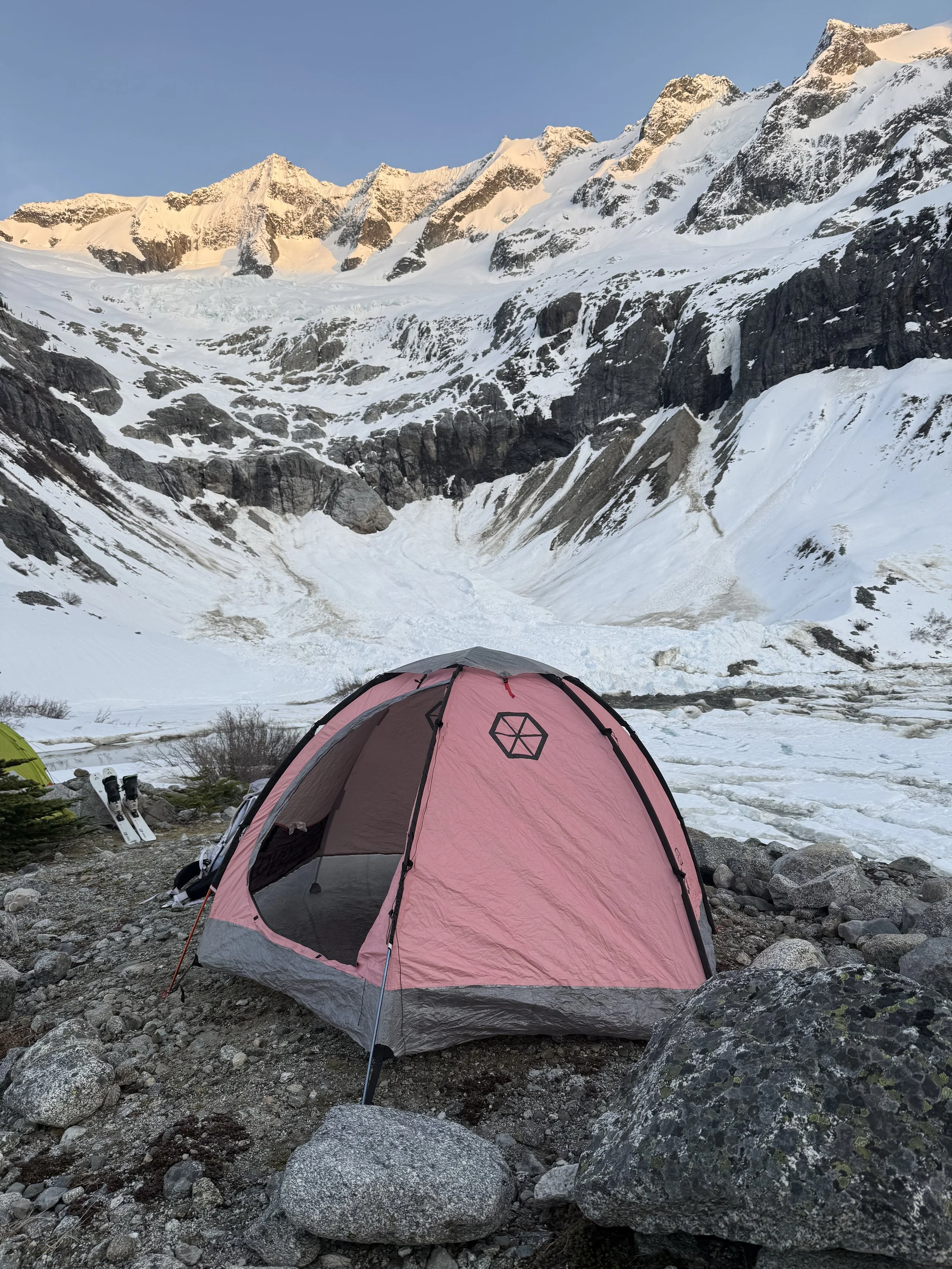 Camp next to Moraine Lake and Forbidden towering above in alpenglow while skiing the Forbidden Tour, North Cascades WA, Photo by Ian Nicholson