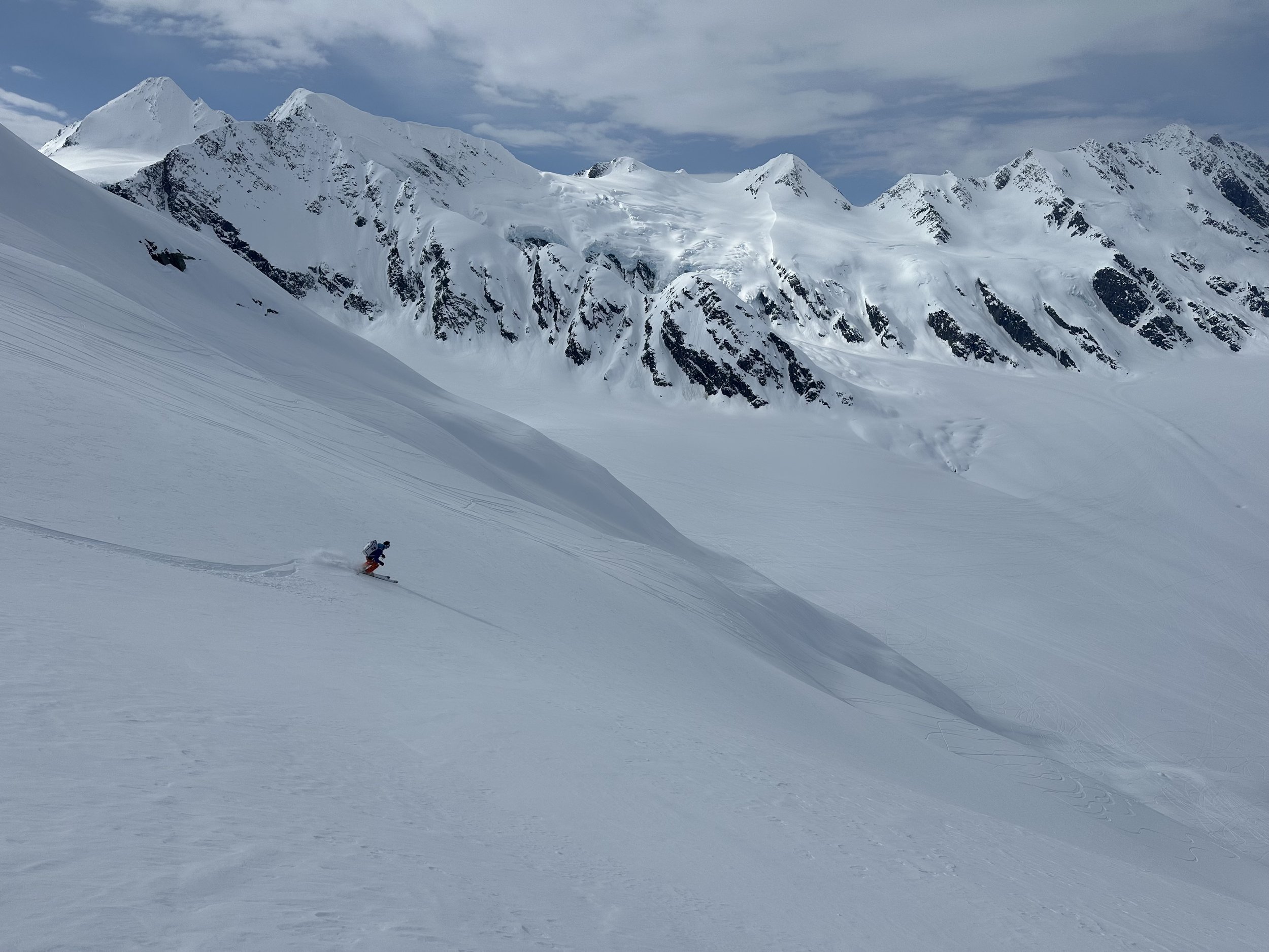 Backcountry Ski the Chugach Mountains, near Thompson Pass, Valdez, Alaska. Ian Nicholson dropping down to the Hoodoo Glacier