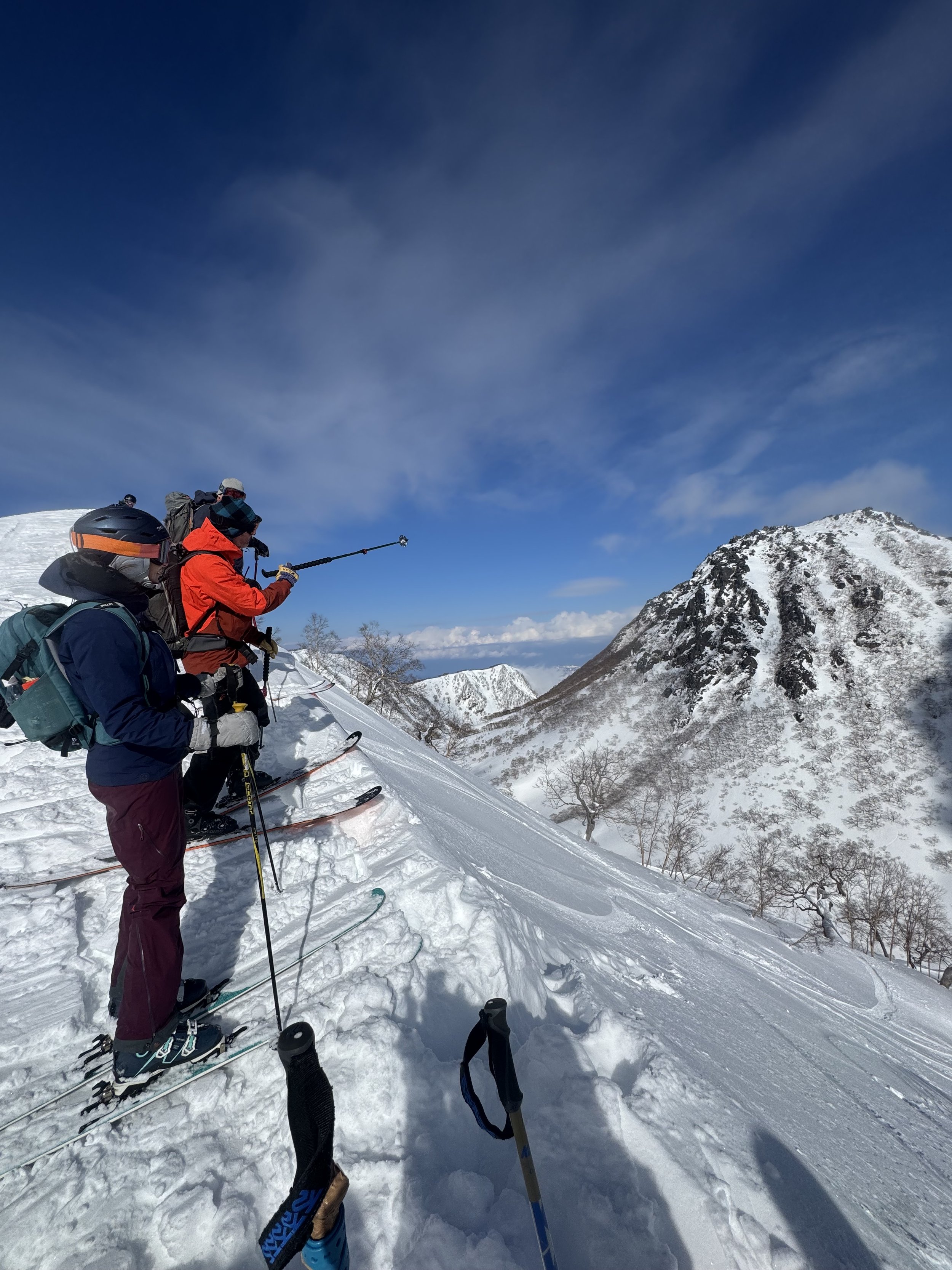 The crew is getting ready to ski down into the Crater of the Volcano Myko San above the resort of Suginoswa, Japan. Photo by Ian Nicholoson