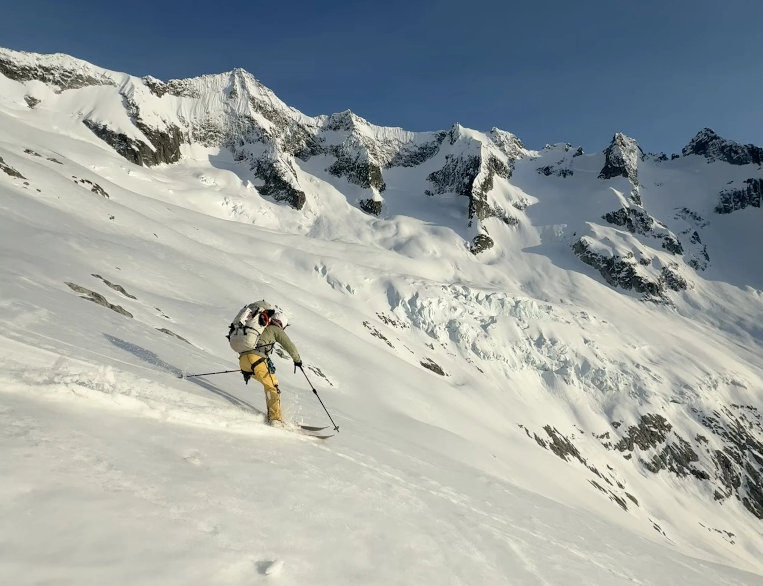 Skiing down towards Moraine Lake on the Forbidden Glacier while skiing the Forbidden Tour, North Cascades WA, Photo by Ian Nicholson