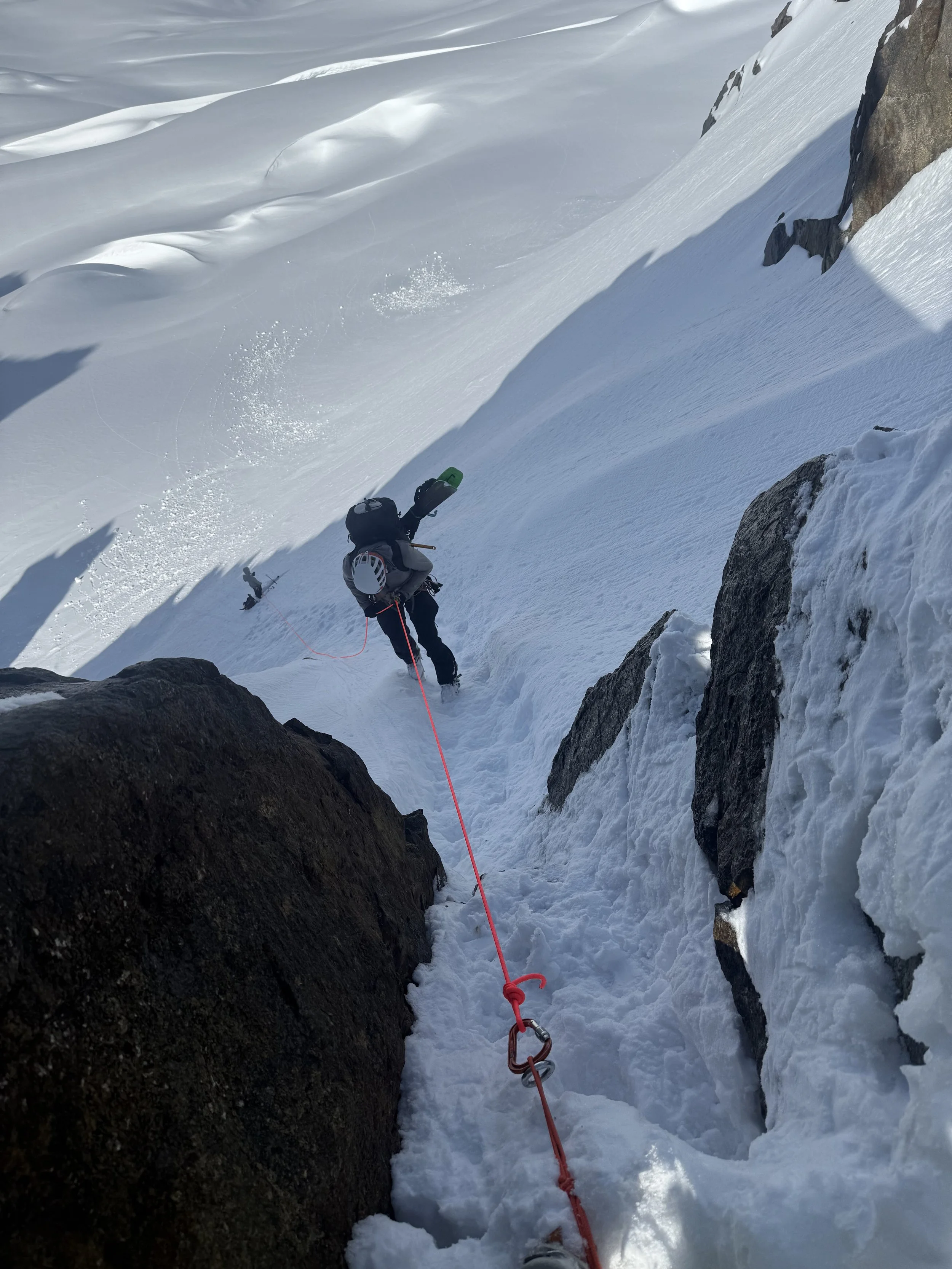 Making the rappel off Sharkfin Col onto the Boston Glacier while skiing the Forbidden Tour, North Cascades WA, Photo by Ian Nicholson
