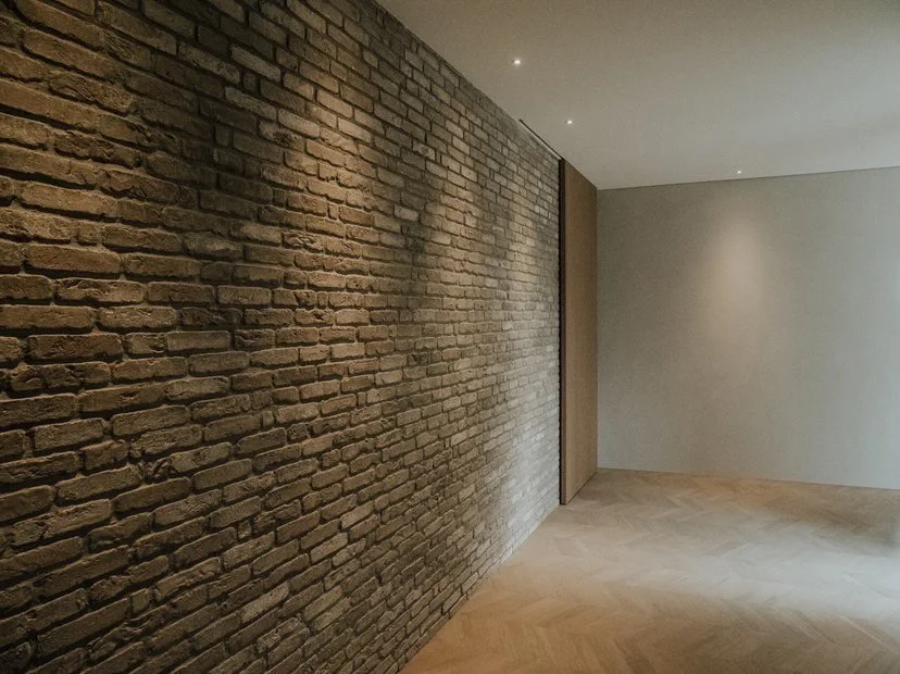 Arrowtown house black wall with down lights
