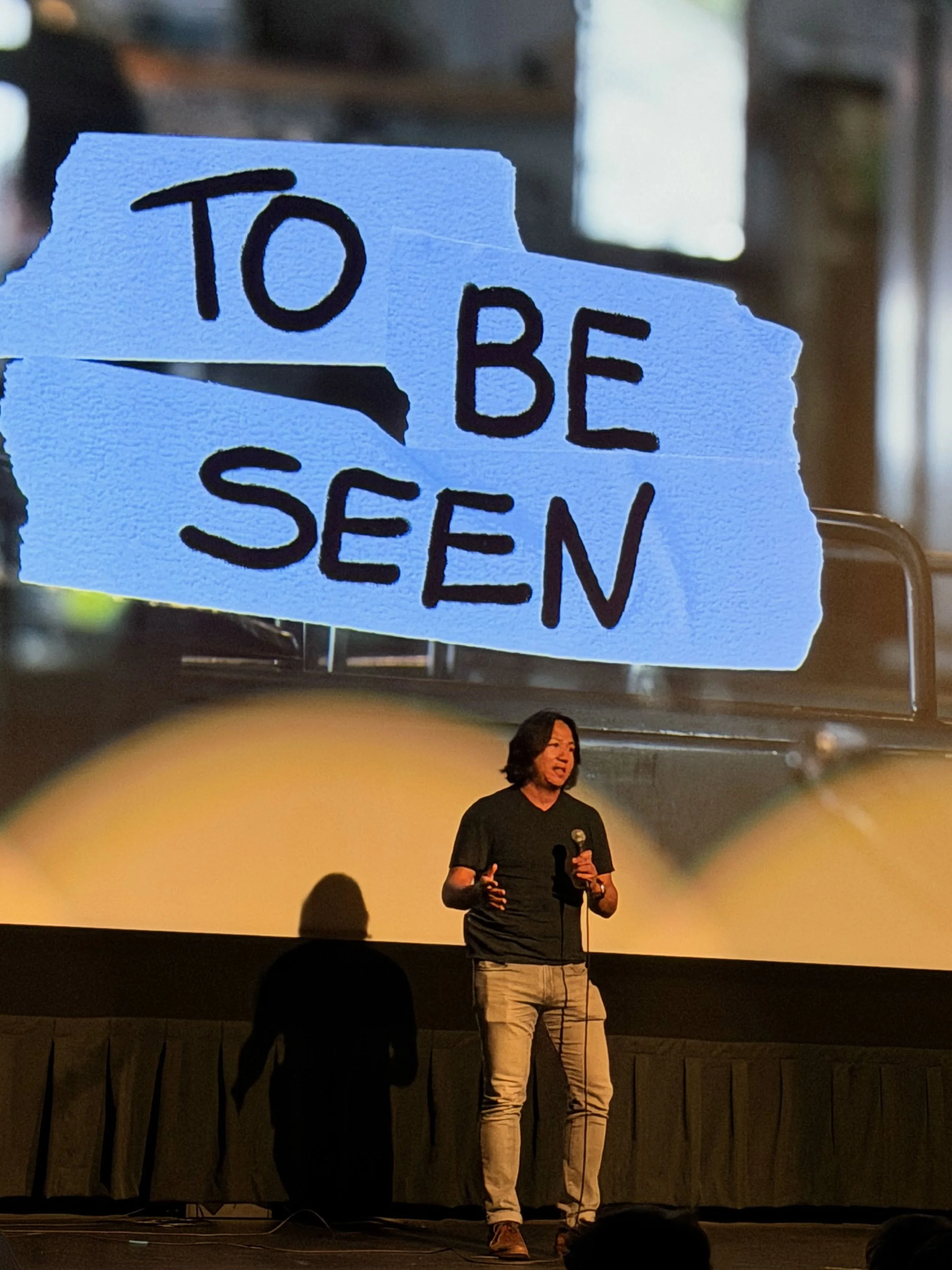 David on stage talking about TO BE SEEN