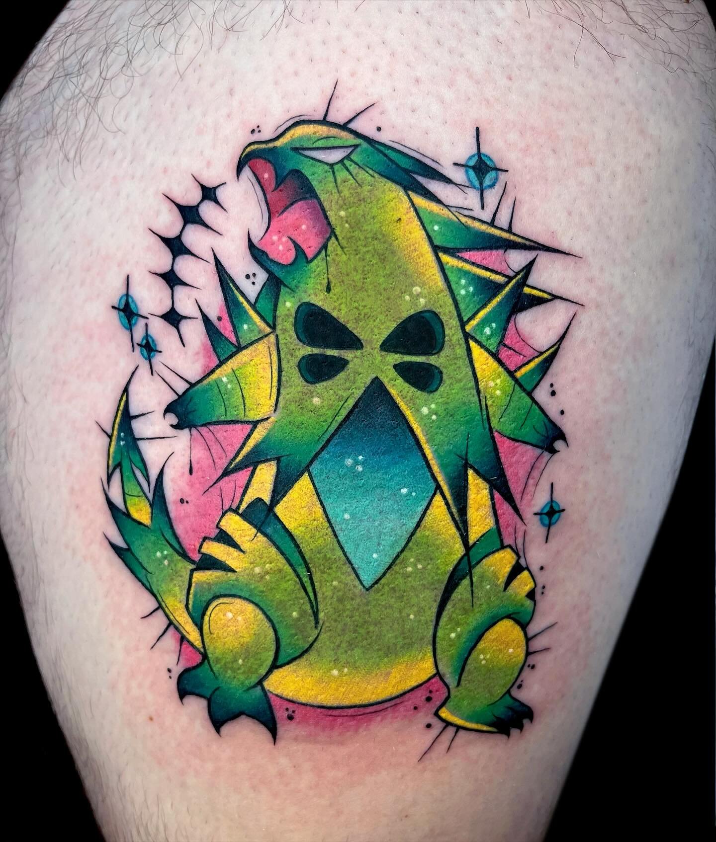 tyranitar for C!!! 💚 thank u so much for sitting tough! sometimes i think about which pokemon would scare me and i think id be scared of this guy lol 🫩 flygon and meganium are still available to be tattooed from this sheet!!! 
&mdash;
🖤 ink.bunni.