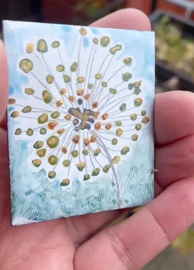 enamel dandelion clock in green and gold luster