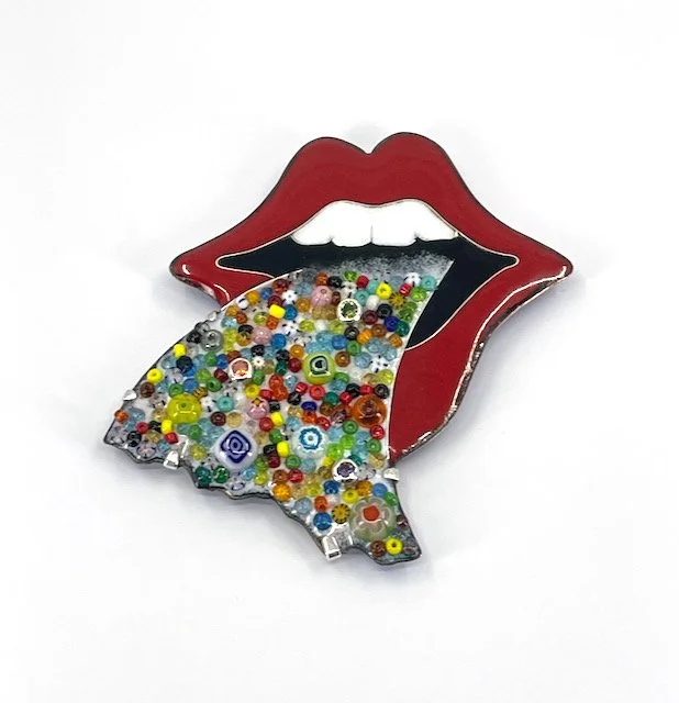 Handmade cloisonné enamel brooch with large red mouth and white teeth and multicolored beads coming out