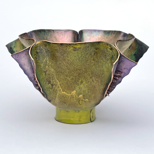 Small cut and shaped copper enamel bowl with fins in green and purple with gold shimmer and beads