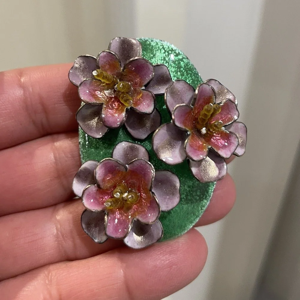 oval pendant with enamel pink roses and green background