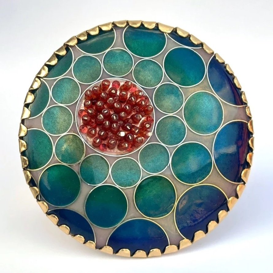 round handmade enamel cloisonné brooch with blue and green circles and pink beads