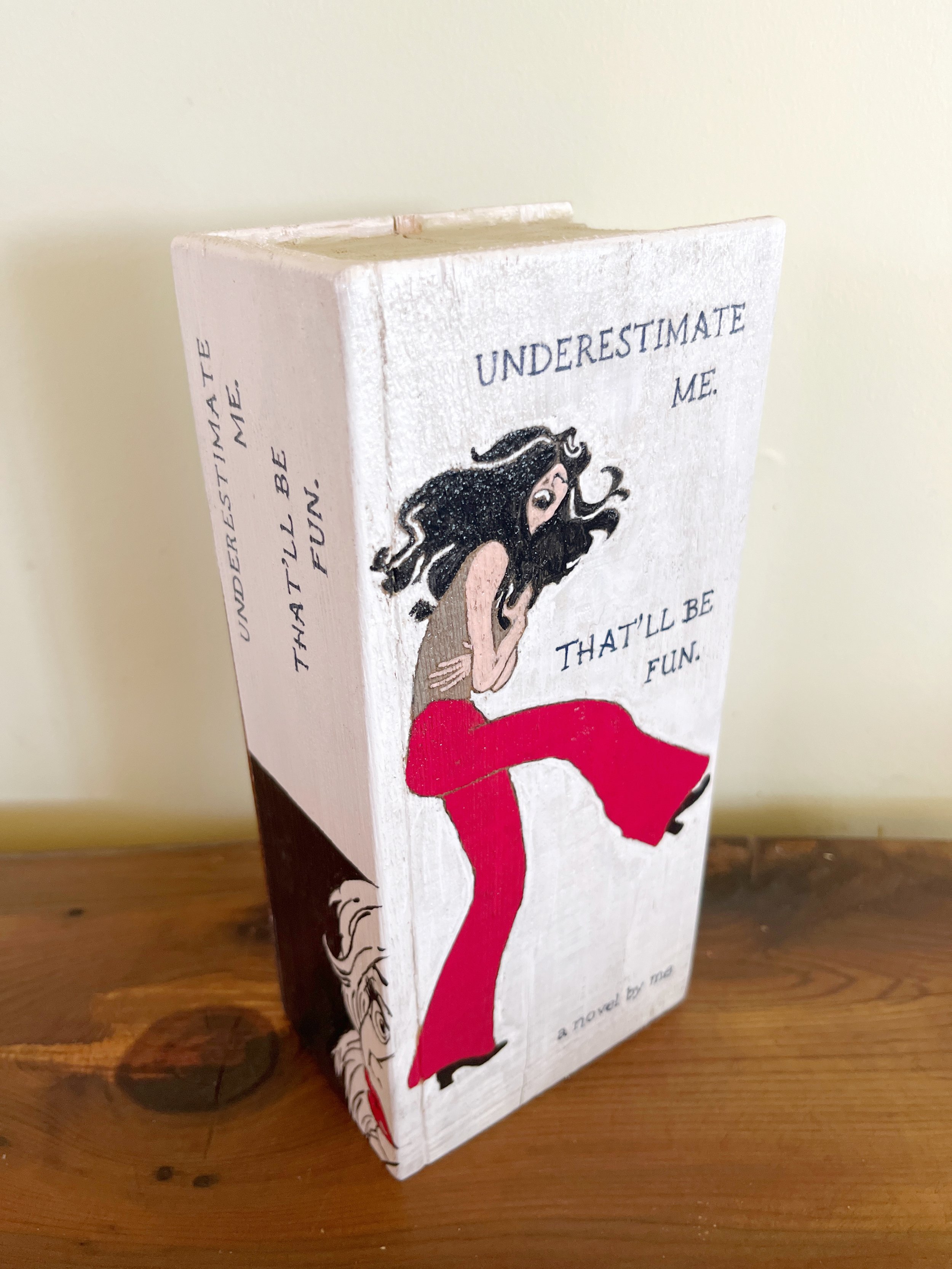 "Underestimate Me, That'll Be Fun"
Hand carved and hand painted Hemlock bookend.