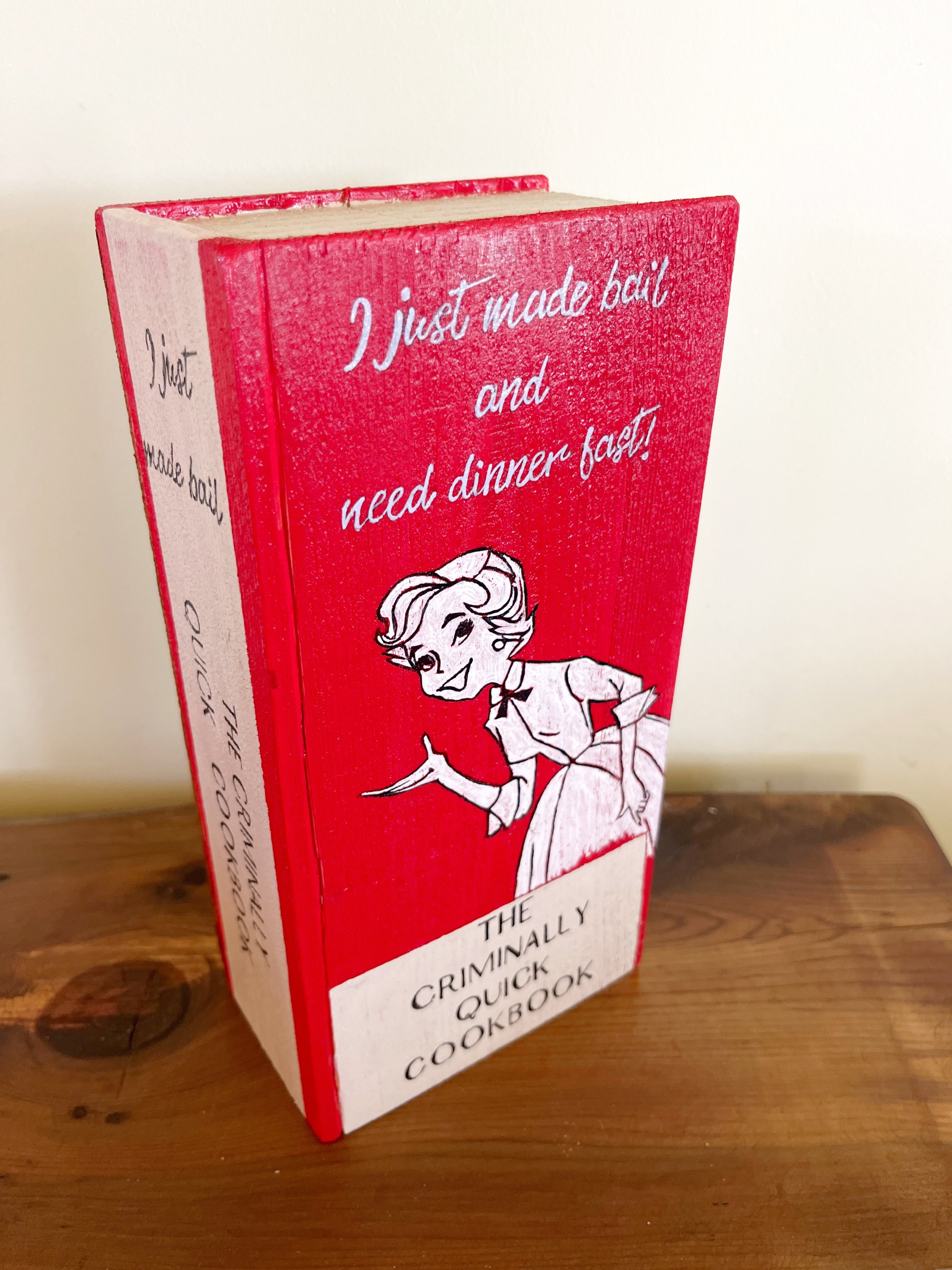 "I Just Made Bail and Need Dinner Fast Cookbook"
Hand carved and hand painted Hemlock bookend.