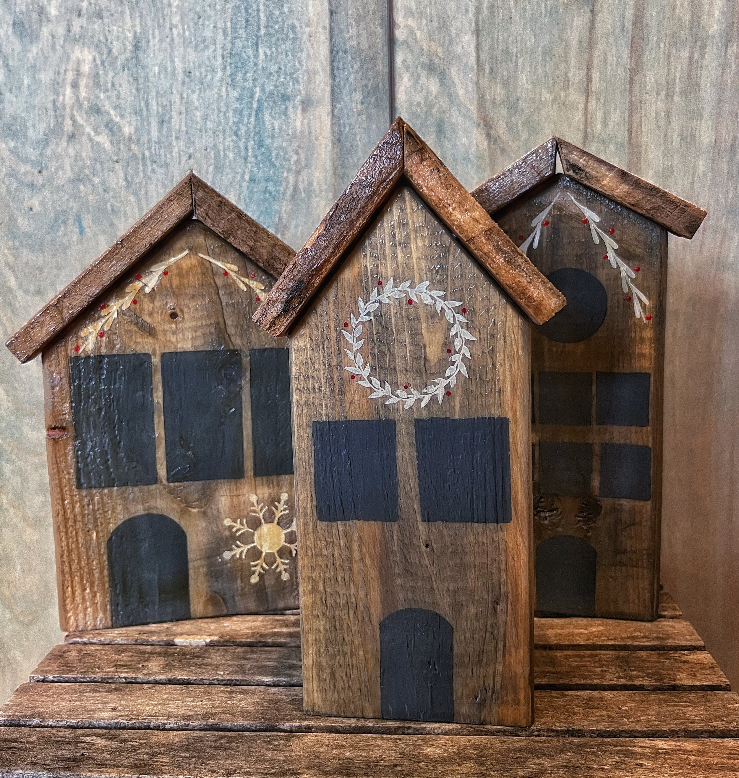 Winter Wonderland homes.
Hand painted on wood salvaged from PEI wharf and lobster traps and transformed into holiday decor.