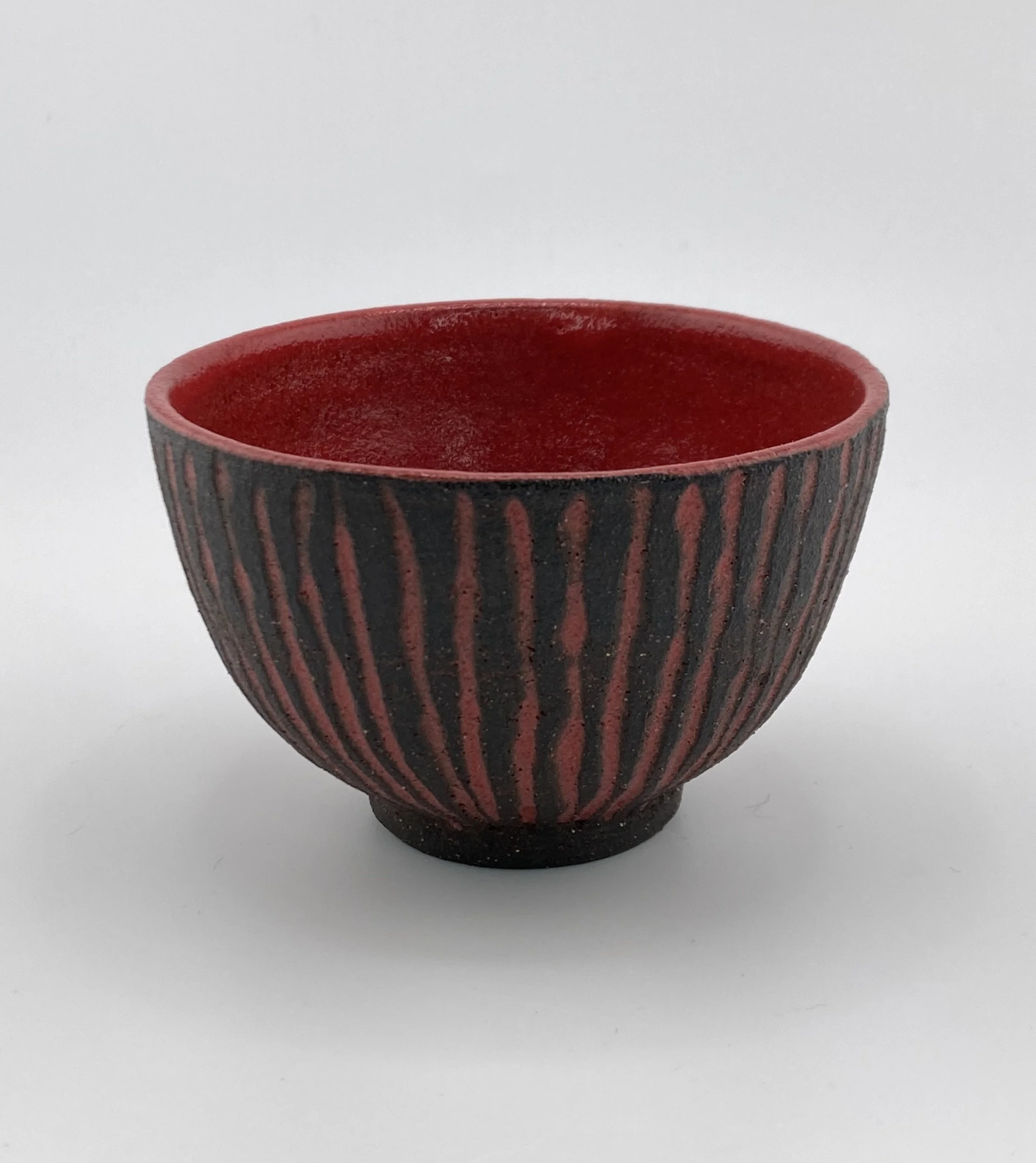 Black and red striped shot glass