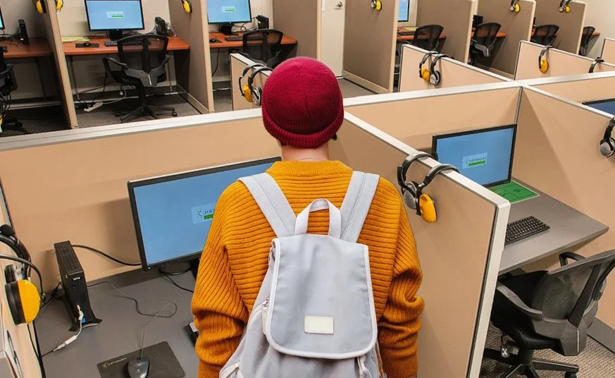 Medical student wearing a backpack starts to take Step 1 at a Prometrics testing center.