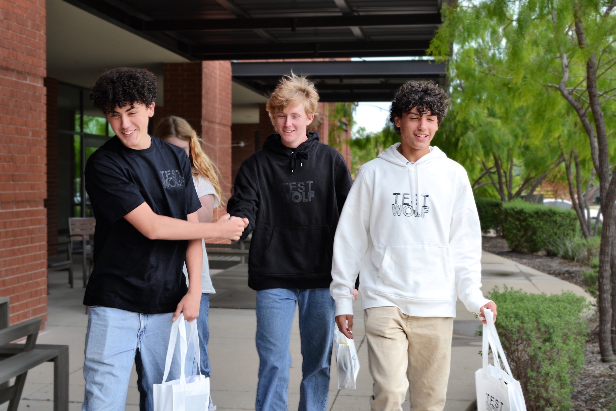 Students walking outside after overcoming test anxiety and taking the SAT.